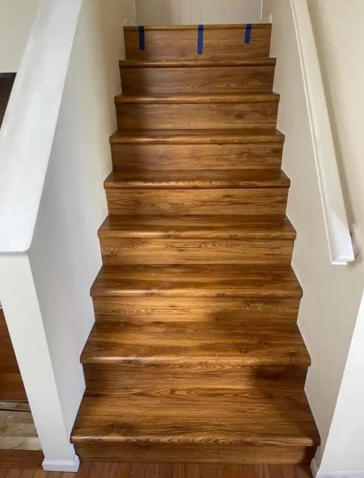 Rich stained-oak staircase with matching treads and risers